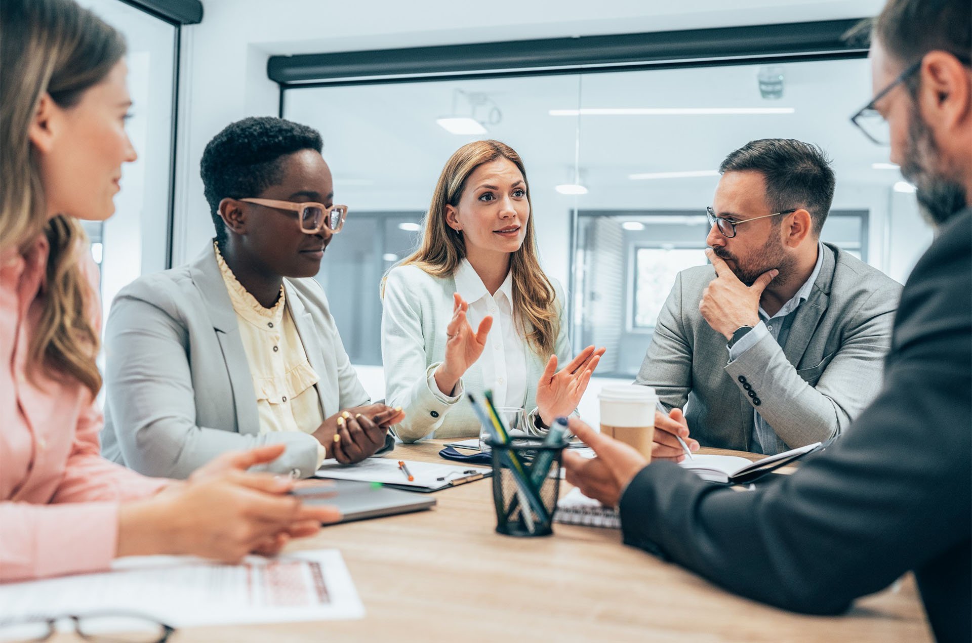 insurance-executive-in-discussion-with-team